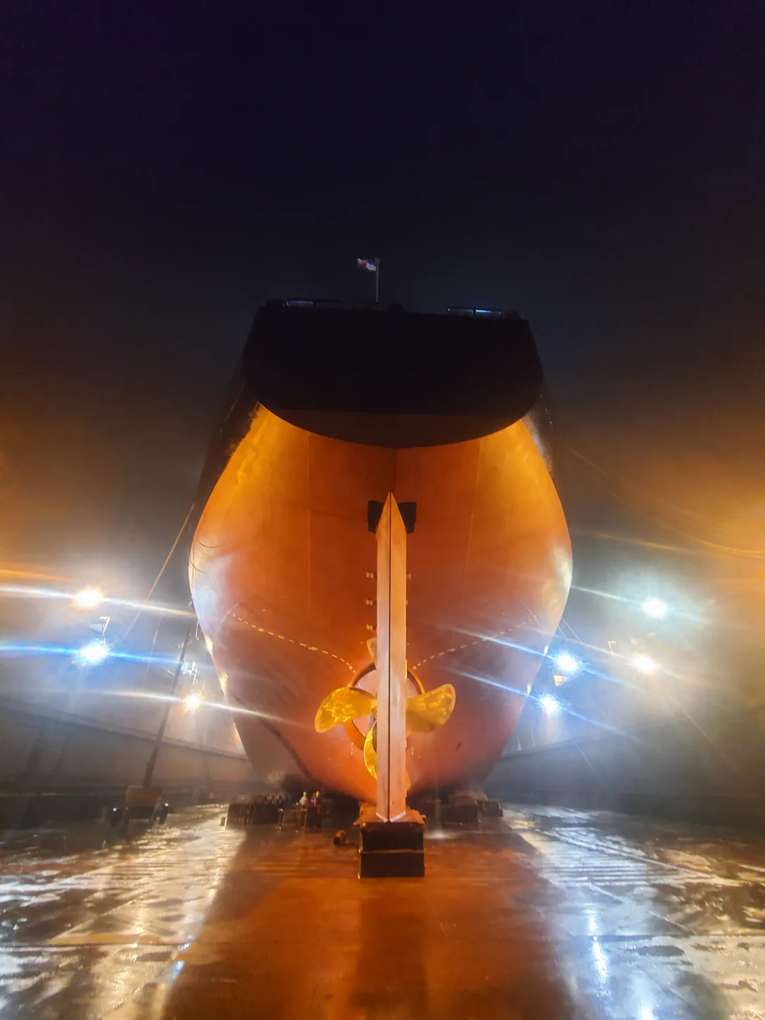Stern-area repair work during a night shift